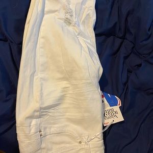 New without tags, size 16 mid rise white jeans